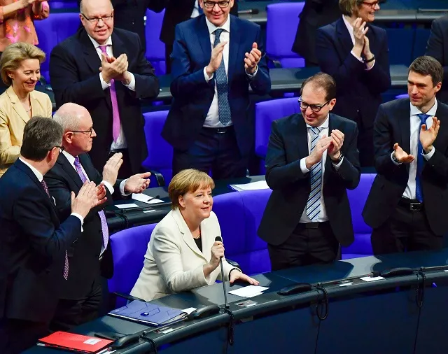german chancellor angela merkel c is applauded after she was re elected as chancellor during a session at the bundestag lower house of parliament on march 14 2018 in berlin photo afp german chancellor angela merkel c is applauded after she was re elected as chancellor during a session at the bundestag lower house of parliament on march 14 2018 in berlin photo afp
