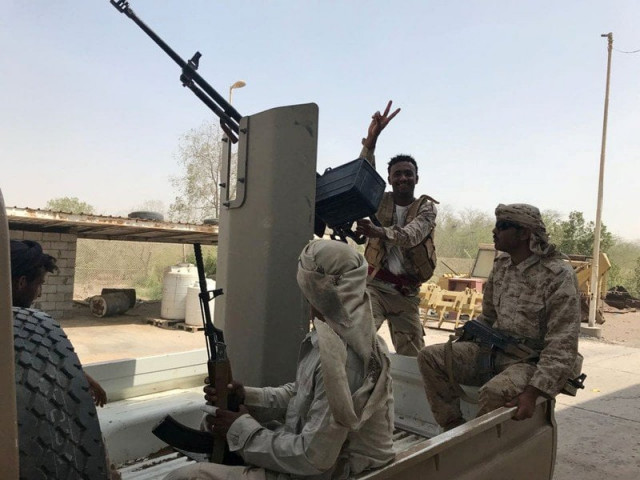 uae backed yemeni soldiers ride on the back of a military patrol vehicle in the red sea port city of al mokha yemen photo reuters