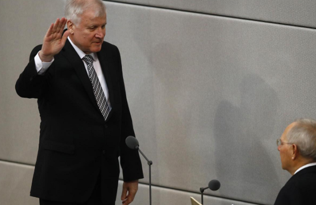 german interior minister horst seehofer is sworn in by parliament president wolfgang schaeuble in germany 039 s lower house of parliament bundestag in berlin photo reuters