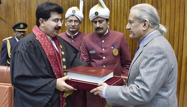 newly elected senate chairman sadiq sajrani with former senate chairman raza rabbani photo inp