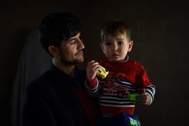 sayed assadullah pooya poses with his son donald trump at home in kabul photo afp