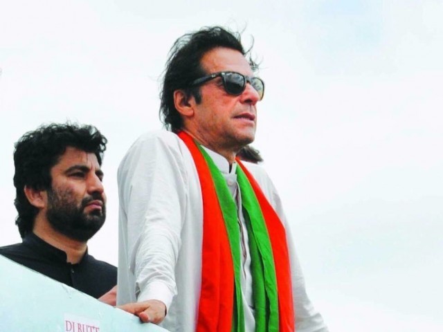 Balochistan Pakistan Tehreek-e-Insaf (PTI) General Secretary Qasim Khan Suri stands behind PTI chief Imran Khan. PHOTO: QASIM KHAN SURI