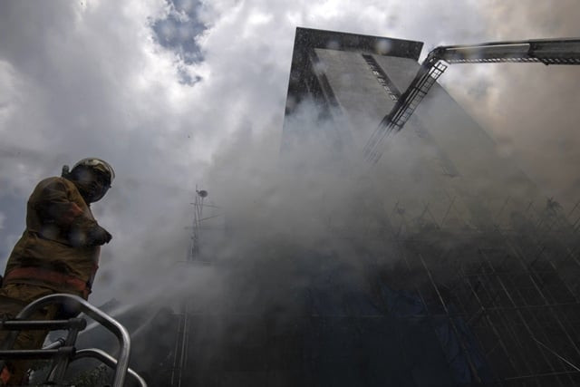 responders sent a helicopter to rescue people trapped on the roof while crews battled to evacuate from lower floors photo afp responders sent a helicopter to rescue people trapped on the roof while crews battled to evacuate from lower floors photo afp