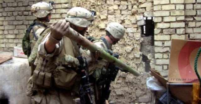us marines break the wall of an abandoned house after being targeted by small arms fire in ramadi photo afp us marines break the wall of an abandoned house after being targeted by small arms fire in ramadi photo afp