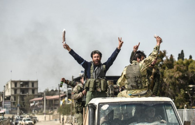 turkish backed syrian arab fighters stand in the back of a vehicle after seizing control of the northwestern syrian city of afrin from the kurdish people 039 s protection units ypg photo afp turkish backed syrian arab fighters stand in the back of a vehicle after seizing control of the northwestern syrian city of afrin from the kurdish people 039 s protection units ypg photo afp