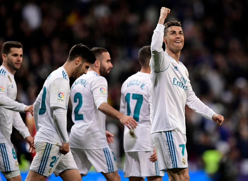 real madrid 039 s portuguese forward cristiano ronaldo celebrates a goal during the spanish league football match between real madrid cf and girona fc at the santiago bernabeu stadium in madrid on march 18 2018 photo afp