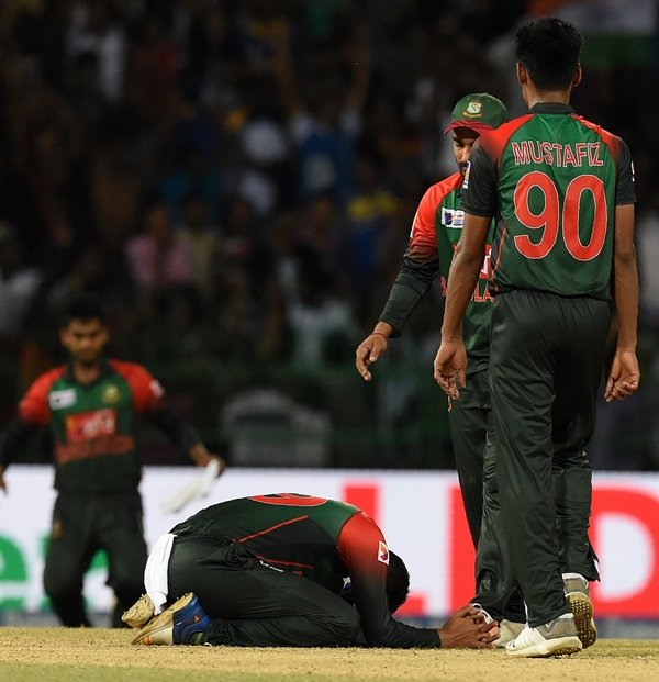 nearly there bangladesh pushed their illustrious neighbours india all the way in sunday 039 s final before dinesh karthik smashed a six off the last ball to secure a four wicket win photo afp