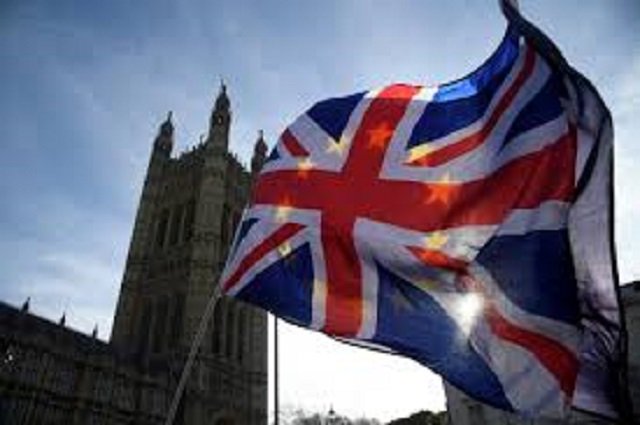 anti brexit demonstrators wave eu and union flags outside the houses of parliament in london britain january 30 2018 reuters