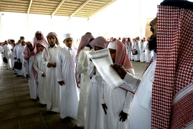 saudi boys stand in line as a teacher takes the attendance on their first day back to school in riyadh photo afp saudi boys stand in line as a teacher takes the attendance on their first day back to school in riyadh photo afp