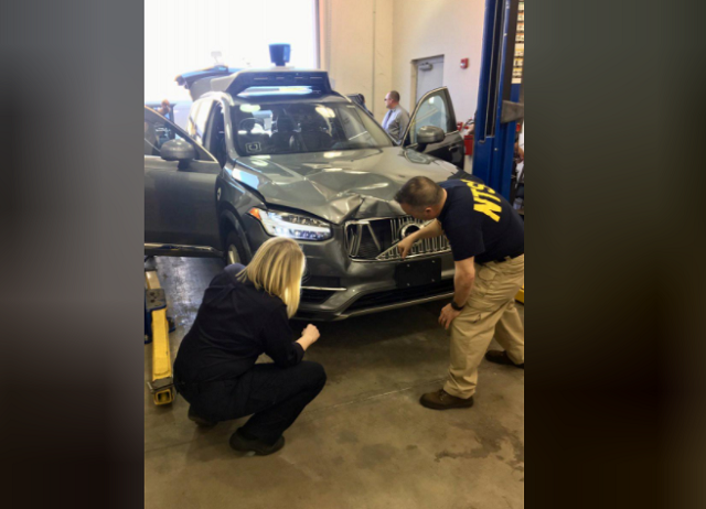 national transportation safety board ntsb investigators examine a self driving uber vehicle involved in a fatal accident in tempe arizona us march 20 2018 photo reuters