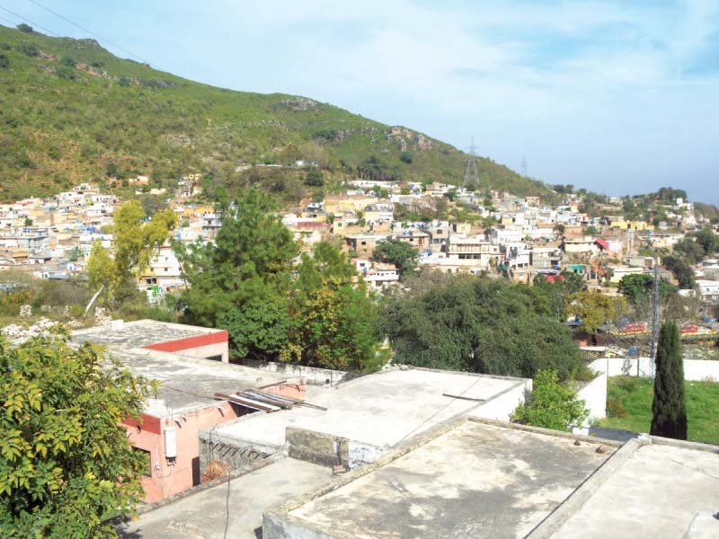 a general view of saidpur village where drains are choked and locals have laid improvised water lines photo waseem imran express