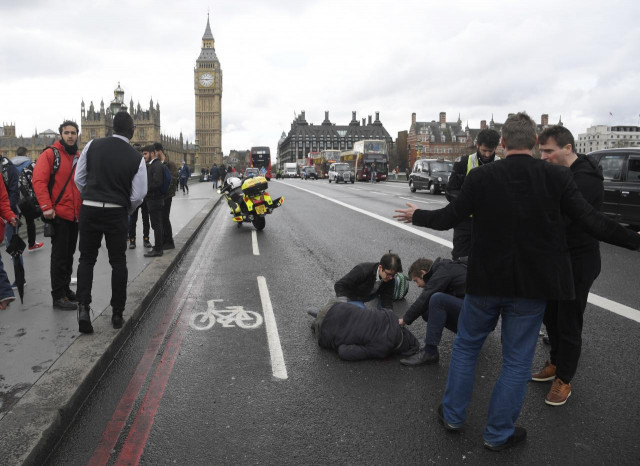 an injured person is assisted after an incident on westminster bridge in london britain photo reuters an injured person is assisted after an incident on westminster bridge in london britain photo reuters