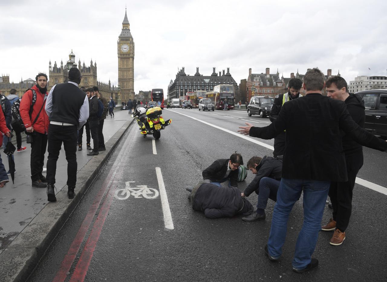 an injured person is assisted after an incident on westminster bridge in london britain photo reuters