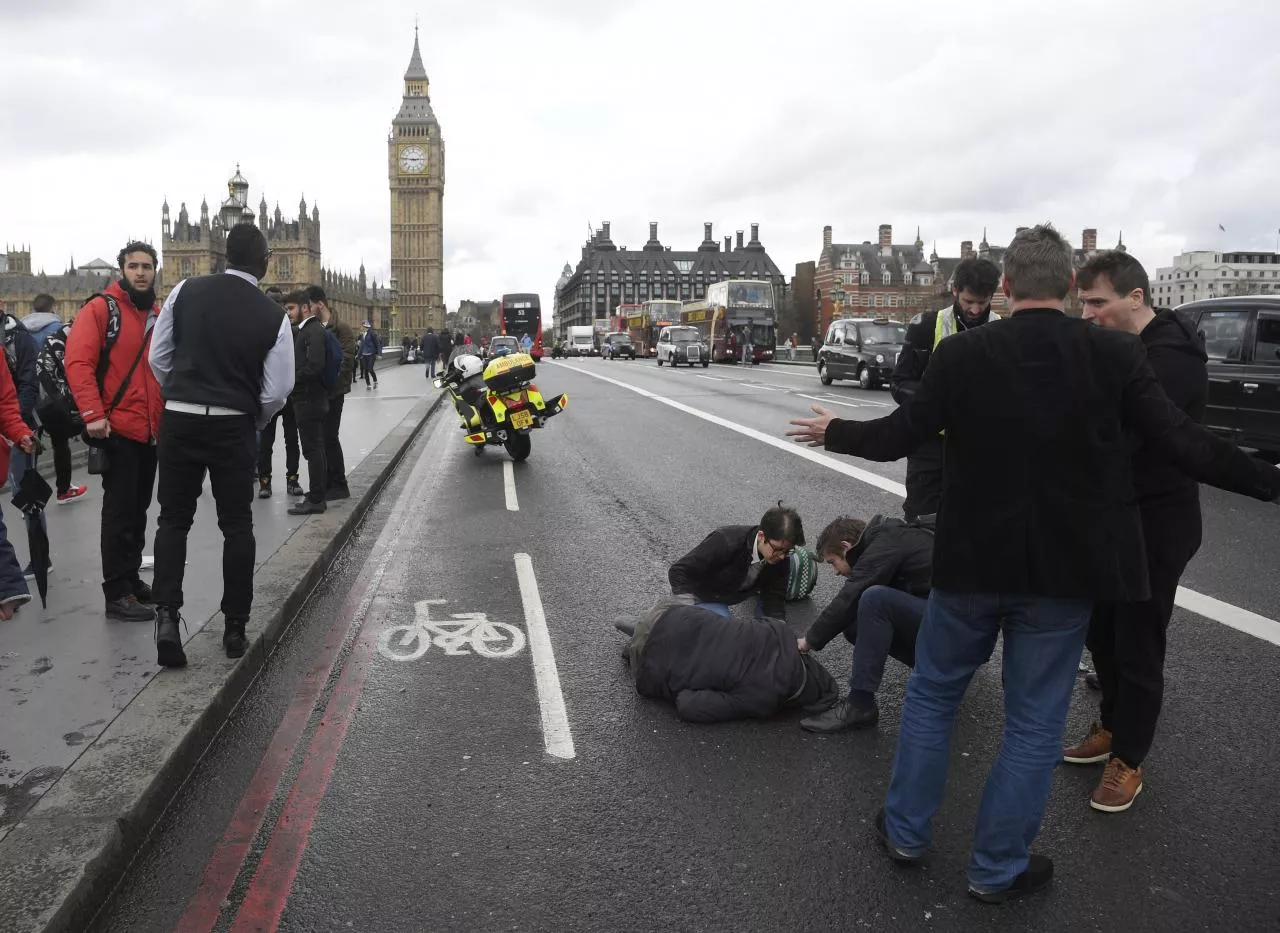 an injured person is assisted after an incident on westminster bridge in london britain photo reuters an injured person is assisted after an incident on westminster bridge in london britain photo reuters