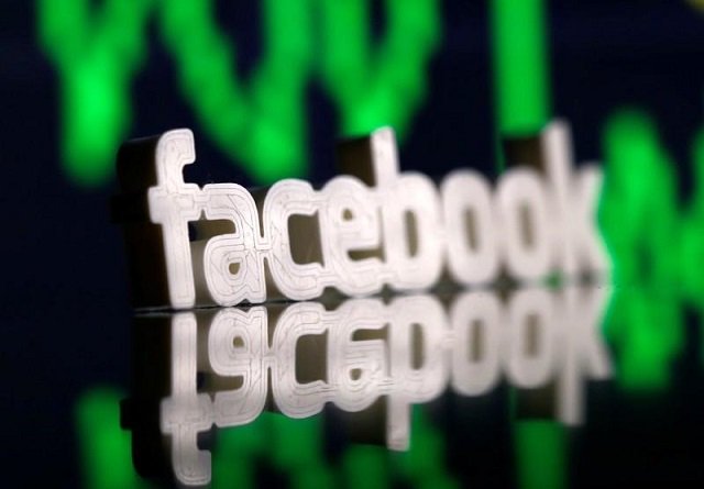 a 3d printed facebook logo is seen in front of displayed stock graph in this illustration photo march 20 2018 photo reuters