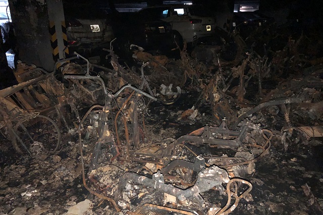 motorbikes are seen burned down in a parking lot after a fire broke out in an apartment block in ho chi minh city vietnam march 23 2018 photo reuters