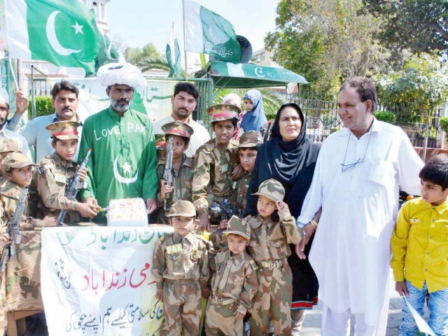 donned in military uniforms schoolchildren pose for a group photo on pakistan day photo online donned in military uniforms schoolchildren pose for a group photo on pakistan day photo online