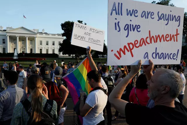demonstrators gather to protest president donald trump 039 s announcement that he plans to reinstate a ban on transgender individuals from serving in any capacity in the us military at the white house in washington photo reuters demonstrators gather to protest president donald trump 039 s announcement that he plans to reinstate a ban on transgender individuals from serving in any capacity in the us military at the white house in washington photo reuters