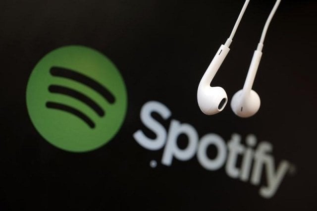 headphones are seen in front of a logo of online music streaming service spotify in this illustration picture taken in strasbourg february 18 2014 photo reuters