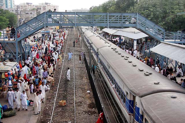 people waiting for their trains at karachi railway station photo afp