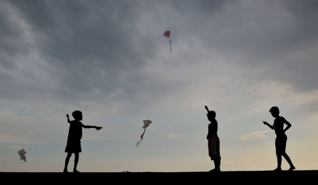 boys are silhouetted as they fly their kites photo reuters boys are silhouetted as they fly their kites photo reuters