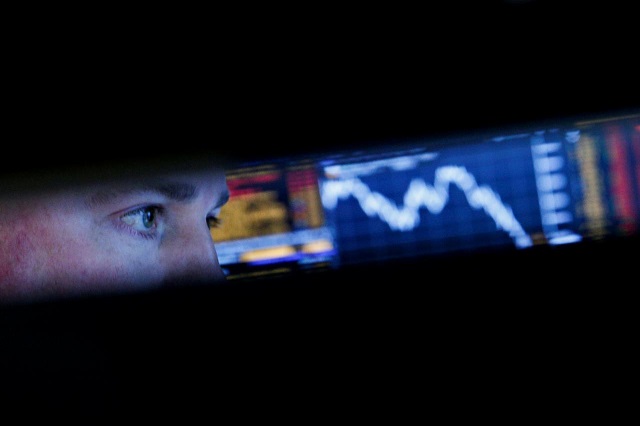a specialist trader works at his post on the floor of the new york stock exchange in new york us march 22 2018 photo reuters