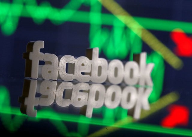 a 3d printed facebook logo is seen in front of displayed stock graph in this illustration photo march 20 2018 picture taken march 20 photo reuters