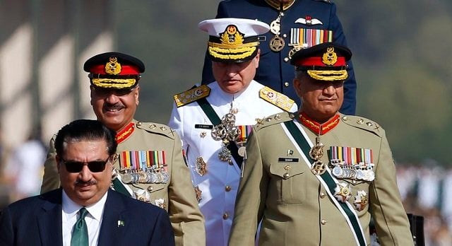 defense minister khurram dastgir with army chief qamar javed bajwa and other officers arrive for a military parade in islamabad photo courtesy voa defense minister khurram dastgir with army chief qamar javed bajwa and other officers arrive for a military parade in islamabad photo courtesy voa