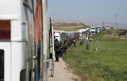 biggest convoy yet evacuates syria s ruined ghouta biggest convoy yet evacuates syria s ruined ghouta