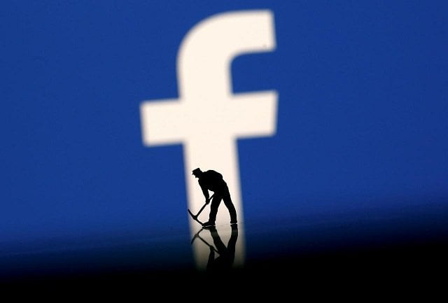 a figurine is seen in front of the facebook logo in this illustration taken march 20 2018 photo reuters a figurine is seen in front of the facebook logo in this illustration taken march 20 2018 photo reuters