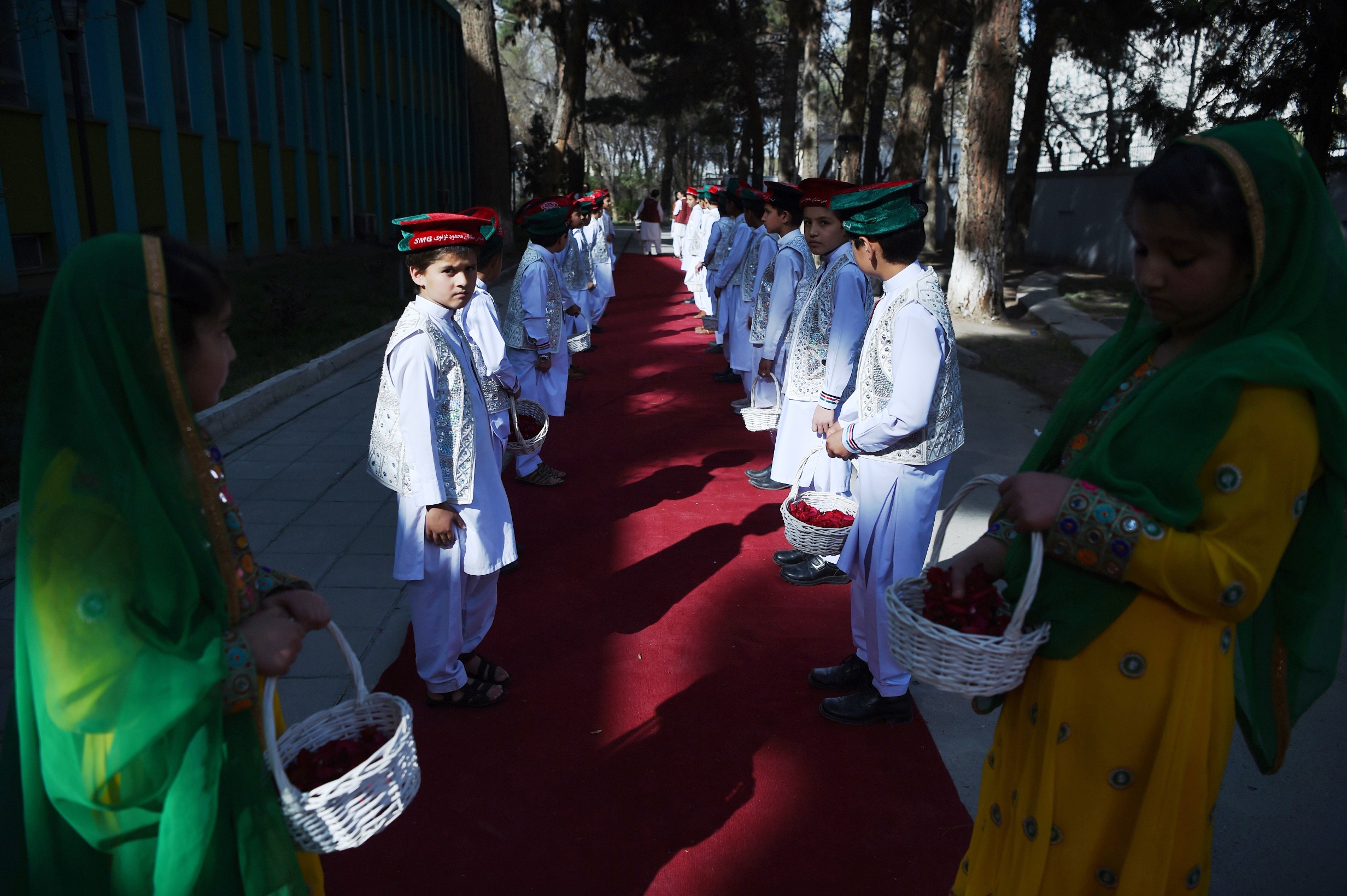 afghan children take part in an event to celebrate the national team s world cup qualification after touching down in the afghan capital the team was whisked to a special ceremony where they received minutes long standing ovations photo afp