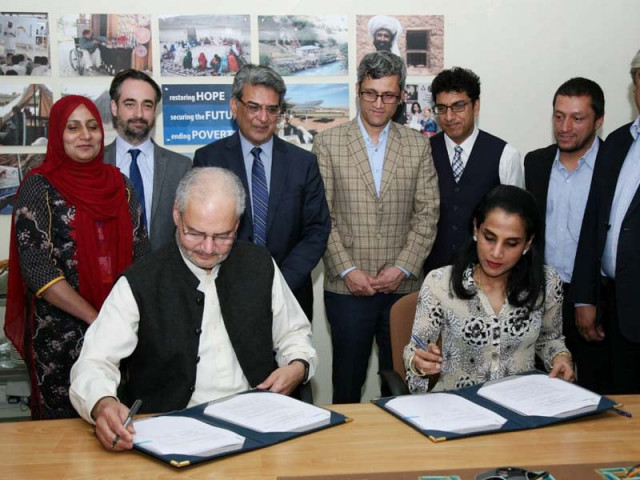 unhcr representative ruvendrini menikdiwela and ppaf ceo qazi azmat isa sign an agreement photo express unhcr representative ruvendrini menikdiwela and ppaf ceo qazi azmat isa sign an agreement photo express