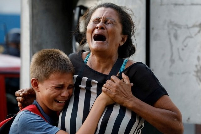 relatives of inmates held at the general command of the carabobo police react as they wait outside the prison where a fire occurred in the cells area according to local media in valencia venezuela march 28 2018 photo reuters relatives of inmates held at the general command of the carabobo police react as they wait outside the prison where a fire occurred in the cells area according to local media in valencia venezuela march 28 2018 photo reuters