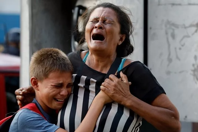 relatives of inmates held at the general command of the carabobo police react as they wait outside the prison where a fire occurred in the cells area according to local media in valencia venezuela march 28 2018 photo reuters relatives of inmates held at the general command of the carabobo police react as they wait outside the prison where a fire occurred in the cells area according to local media in valencia venezuela march 28 2018 photo reuters