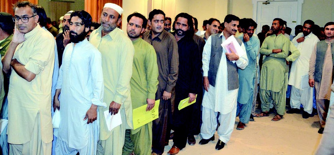 people of balochistan standing in a line outside an open court in quetta photo express