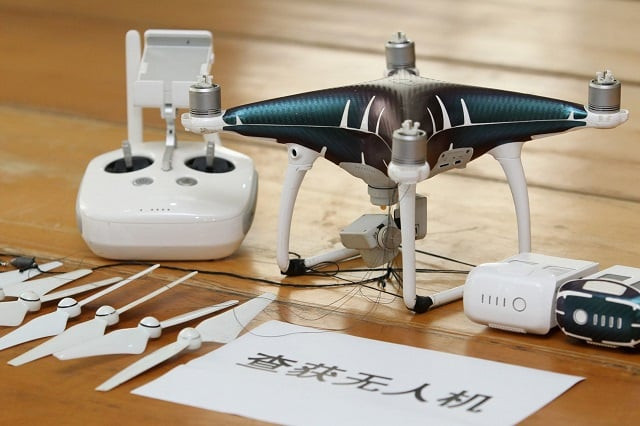 a drone that was confiscated after authorities arrested suspects who used drones to smuggle smartphones from hong kong to shenzhen is pictured in shenzhen guangdong province china march 29 2018 photo reuters a drone that was confiscated after authorities arrested suspects who used drones to smuggle smartphones from hong kong to shenzhen is pictured in shenzhen guangdong province china march 29 2018 photo reuters