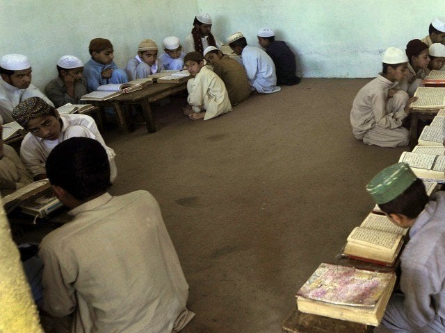 due to the absence of the required number of schools and colleges a large number of parents have been compelled to put their children into madrassas photo afp