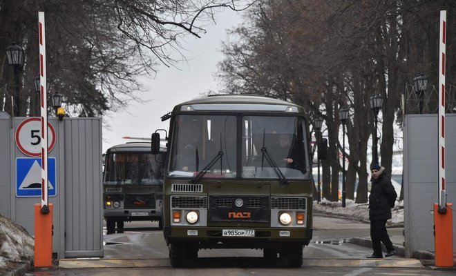 buses drive out of the airport after the russian il 96 jet that brought back 46 russian diplomats and their family members from the russian government airport vnukovo ii in mosow on april 1 photo afp