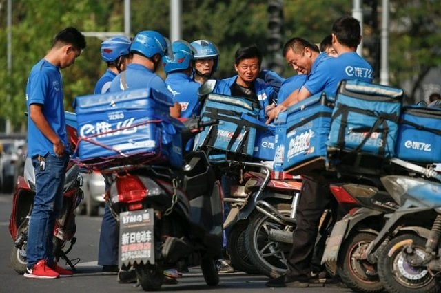 drivers of the food delivery service ele me prepare to start their morning shift after an internal security check in beijing china september 21 2017 photo reuters