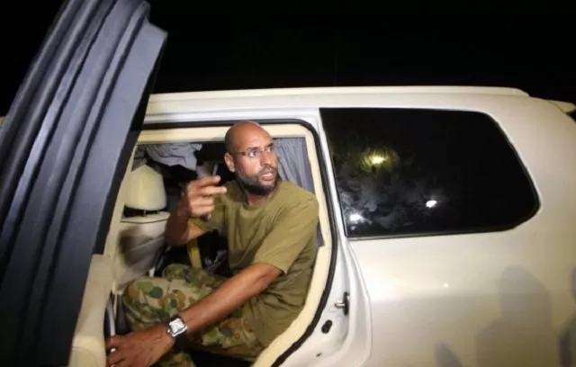 this file photo taken on august 23 2011 shows seif al islam gaddafi son of libyan leader muammar gaddafi appearing in front of supporters and journalists at his father 039 s residential complex in the libyan capital tripoli photo afp this file photo taken on august 23 2011 shows seif al islam gaddafi son of libyan leader muammar gaddafi appearing in front of supporters and journalists at his father 039 s residential complex in the libyan capital tripoli photo afp