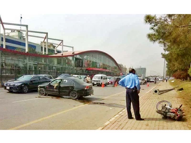 view of a damaged car and motocycle involved in a collision on jinnah avenue in the federal capital photo agenceis