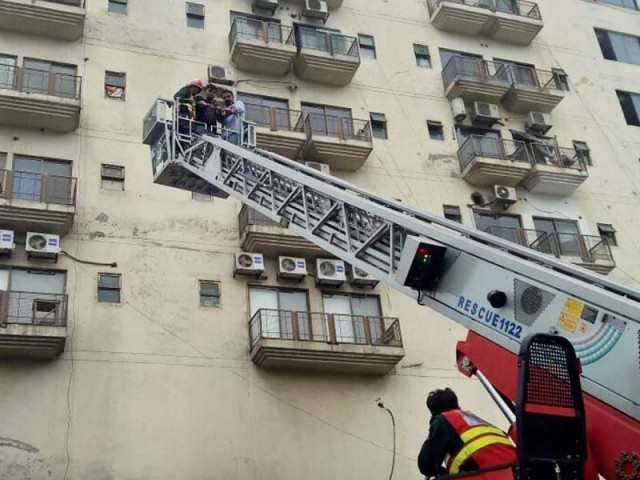 rescue workers inspect shops after a fire broke out at barkat market photo nni online rescue workers inspect shops after a fire broke out at barkat market photo nni online