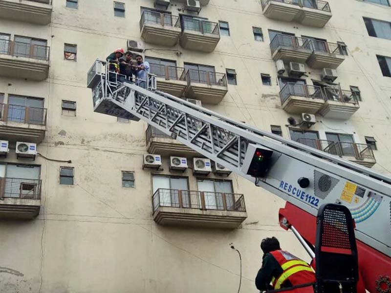 rescue workers inspect shops after a fire broke out at barkat market photo nni online