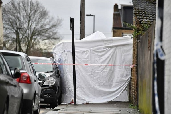 a police forensics tent at the scene of the fatal shooting of a teenager in north london on monday night photo afp