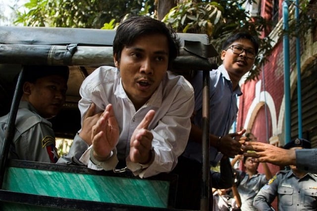 kyaw soe oo c and wa lone r at the time of their arrest four months ago the reporters were investigating the killing by security forces and ethnic rakhine locals of 10 unarmed rohingya muslim men photo afp