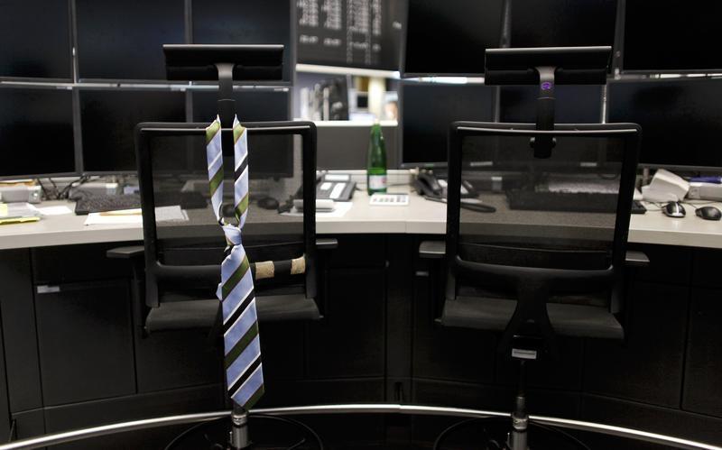 a tie hangs from an empty chair on a desk photo reuters