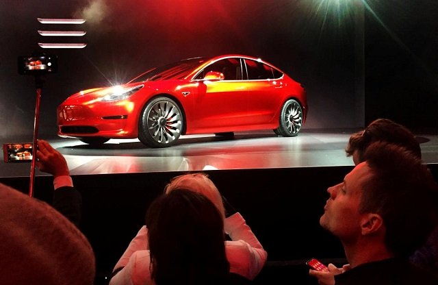 a tesla model 3 sedan its first car aimed at the mass market is displayed during its launch in hawthorne california us march 31 2016 photo reuters