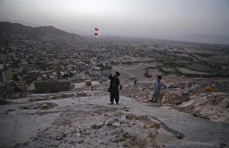 a boy from the hazara community flies a kite on a hilltop overlooking houses in mehrabad quetta on august 29 2012 photo reuters a boy from the hazara community flies a kite on a hilltop overlooking houses in mehrabad quetta on august 29 2012 photo reuters