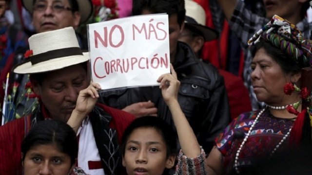 a boy holds a sign that reads no more corruption during a demonstration in guatemala photo reuters file