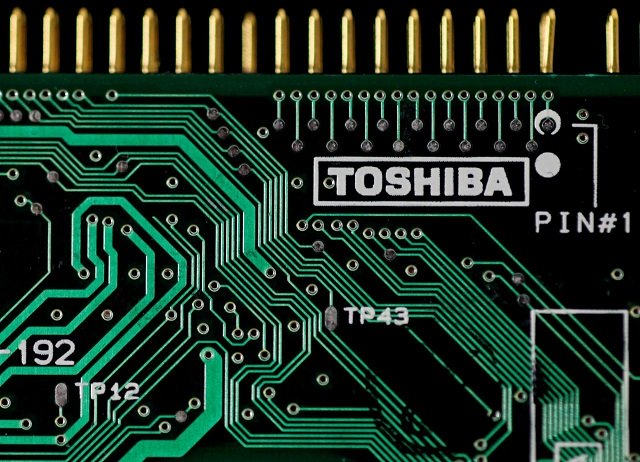 a logo of toshiba is seen on a printed circuit board in this photo illustration taken in tokyo july 31 2012 photo reuters